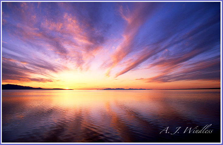 Eloquent sunset clouds reflect and radiate from the horizon over the Great Salt Lake.