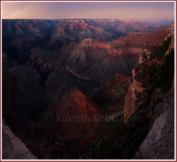 Overlook of the peaks and gorges of the Grand Canyon after the sun sets.