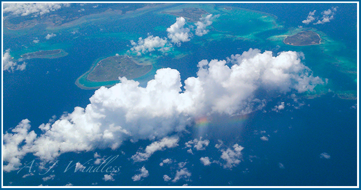 View from above of small Japanese islands blessed with a rainbow.