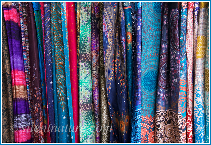 An assortment of very colorful, artistic, and sleek Thai silk.